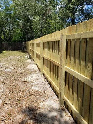 Close view of a newly installed wood privacy fence